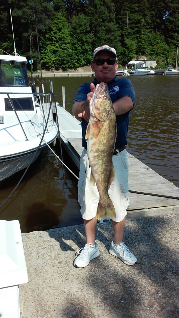 A man holding up a large fish