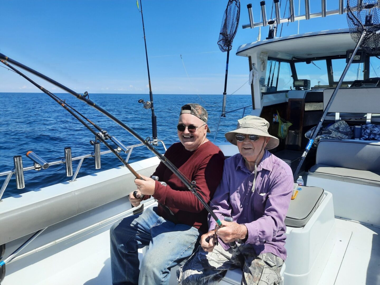 Two elderly men enjoying their fishing trip